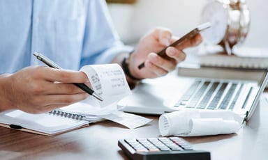 person calculating receipts 