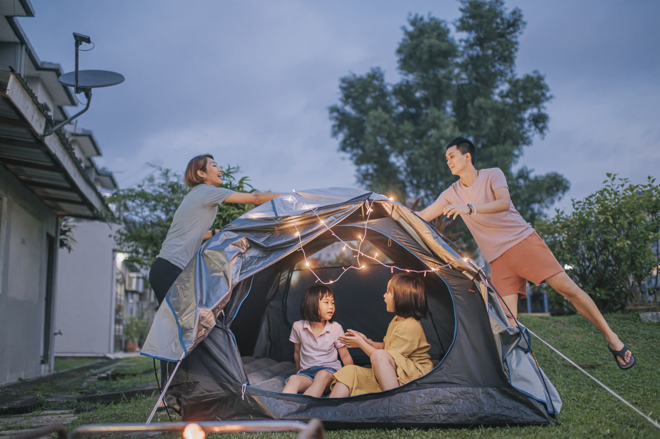 family setting up a tent