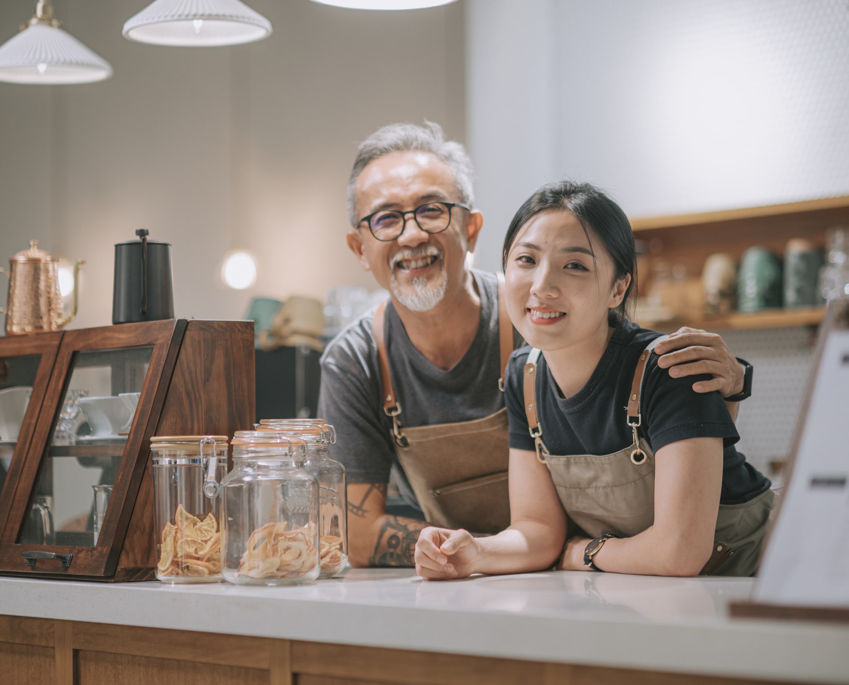 employees smiling behind the counter