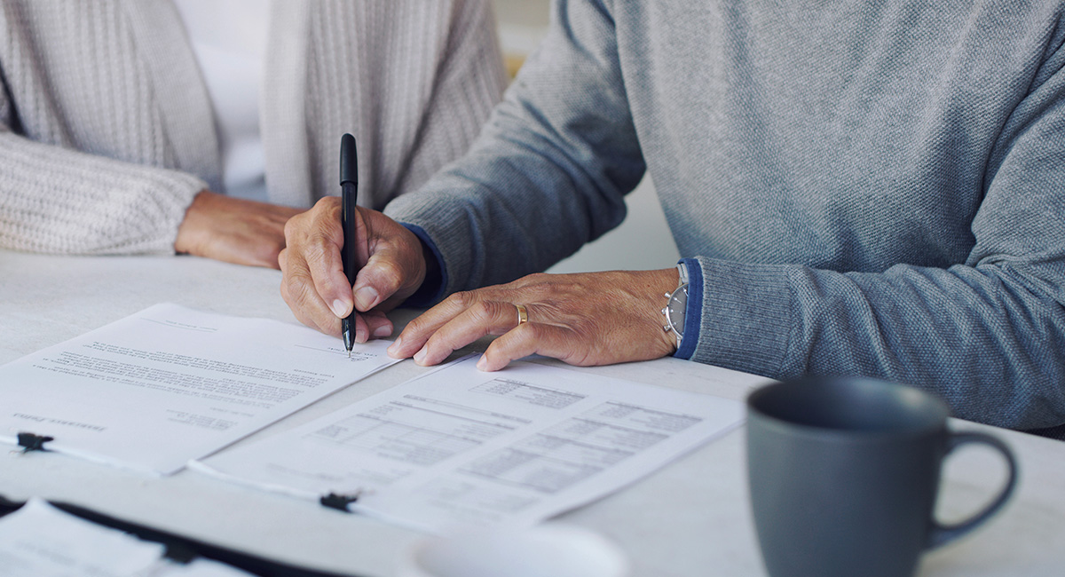 Man signing a document