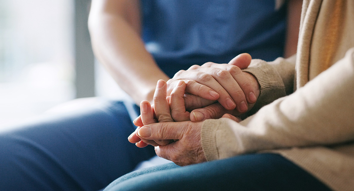 Two people holding hands