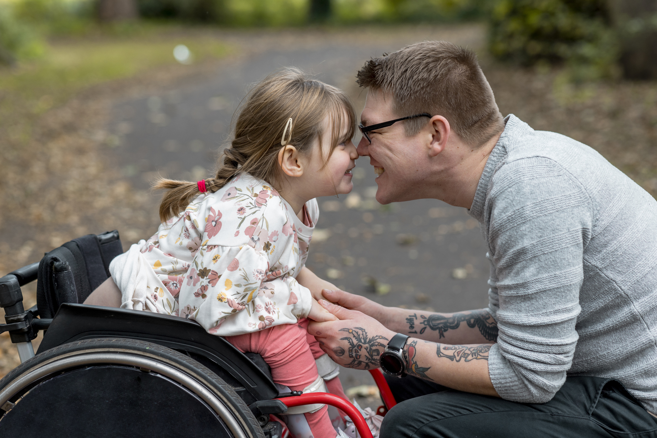 Father with child who is in a wheelchair